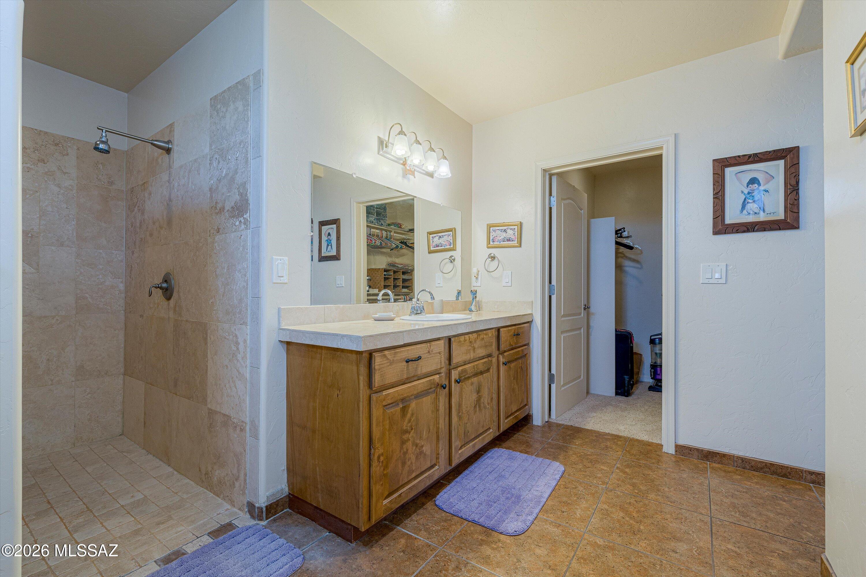 4677 East Rail N Road Tucson, AZ 85739 - Photo 32 of 48 En-suite #3 with walk in tiled shower, walk in closet and patio door to pool oasis