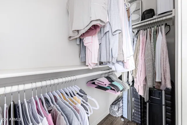 a bedroom with a bed and a book shelf