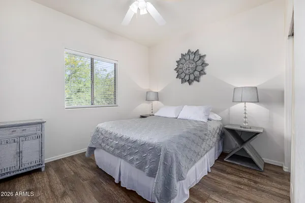a bedroom with bed and window