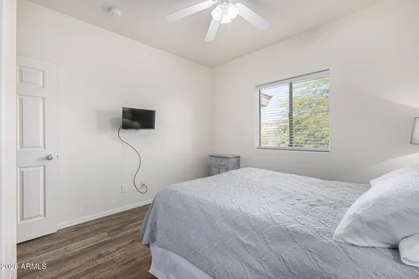 a bedroom with a bed and a window