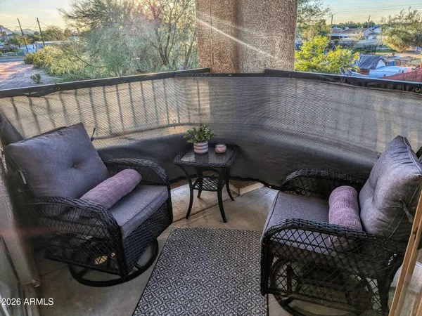 a backyard of a house with outdoor seating