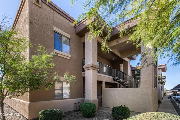 a view of a brick building next to a road