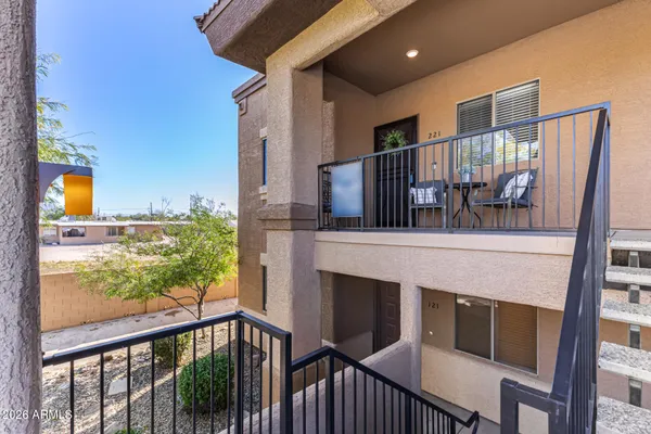a view of balcony with furniture