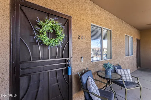 a view of a workspace with furniture and a potted plant