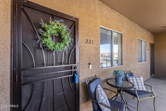 a view of a workspace with furniture and a potted plant