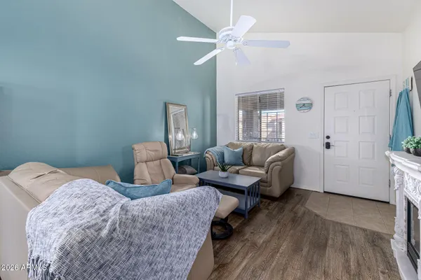 a bedroom with a bed couch and a window