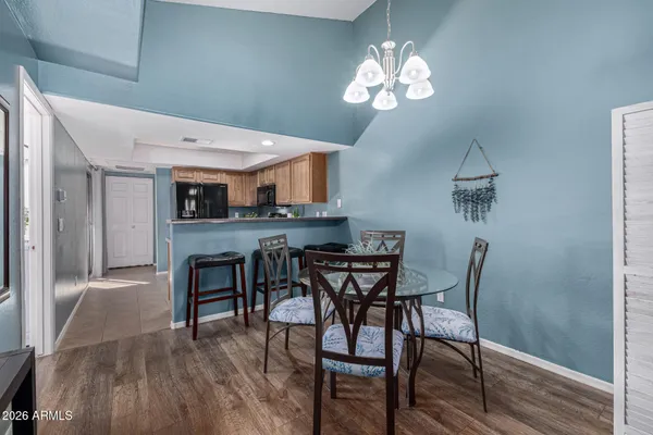 a view of a dining room with furniture and wooden floor