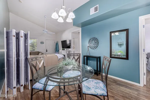 a view of a dining room with furniture and wooden floor