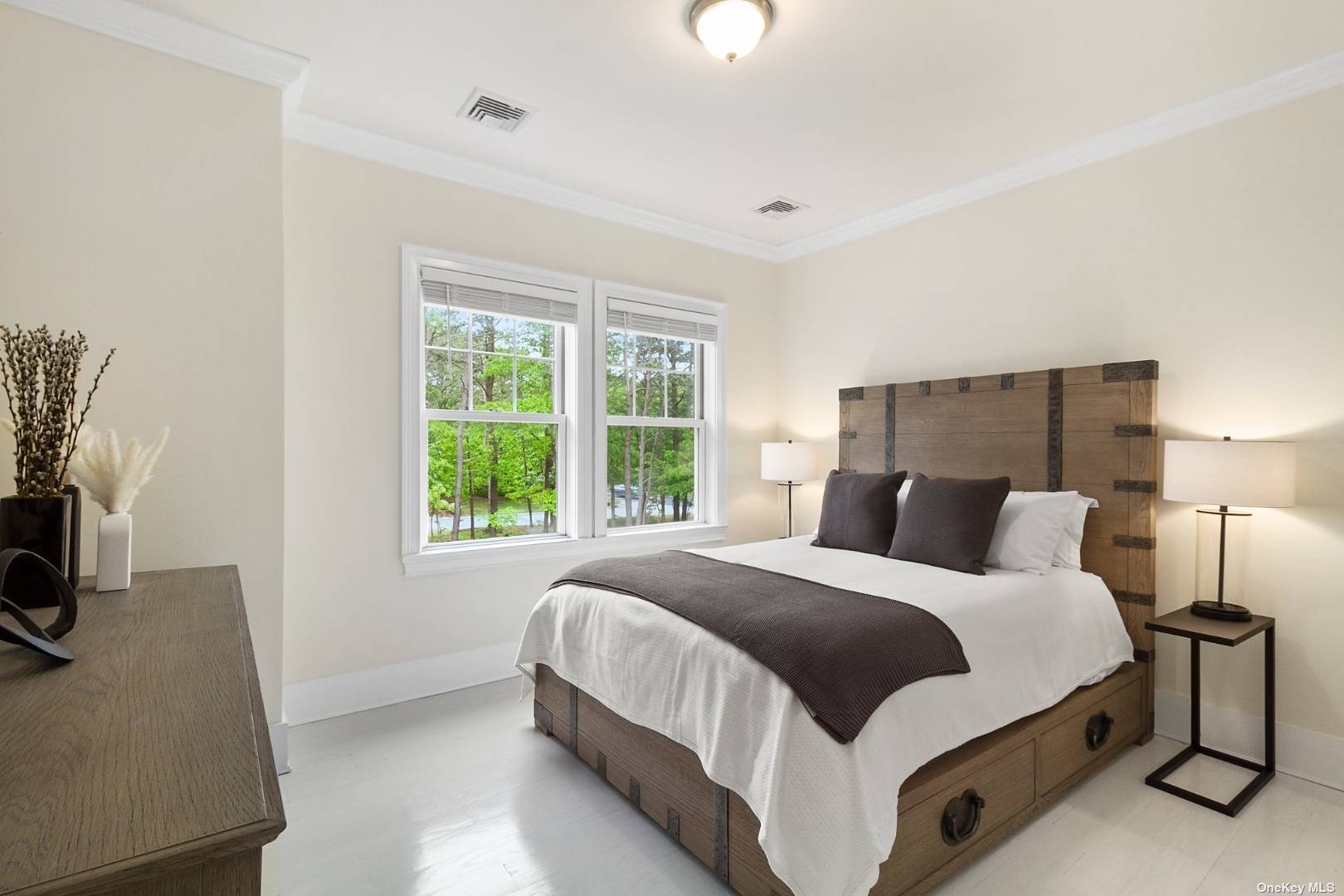 2 Westhampton, undefined 00000 - Photo 18 of 31 a bedroom with a bed and a flat tv screen on a dresser