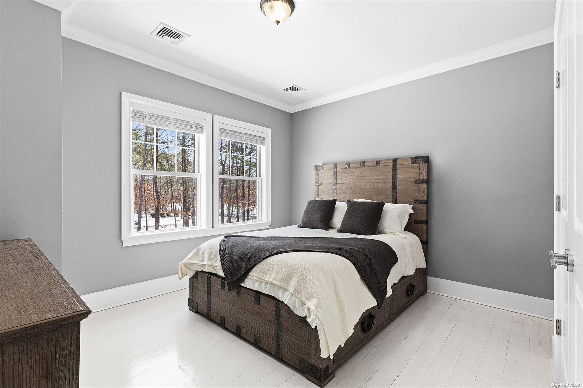 2 Westhampton, undefined 00000 - Photo 24 of 31 a large bed sitting in a bedroom next to a window