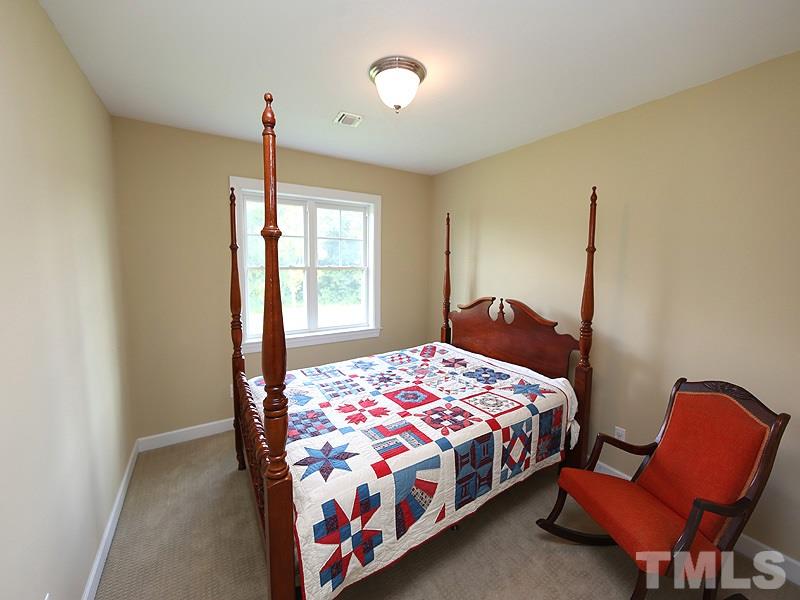 130 Russell Union Road Norlina, NC 27563 - Photo 15 of 20 a bedroom with a bed and chair