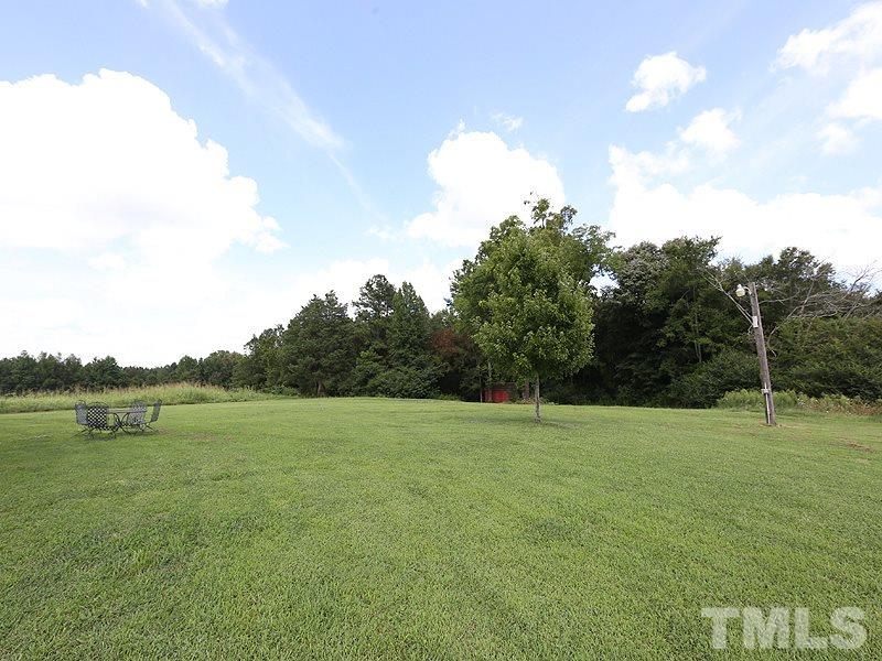 130 Russell Union Road Norlina, NC 27563 - Photo 20 of 20 a view of outdoor space with deck and trees