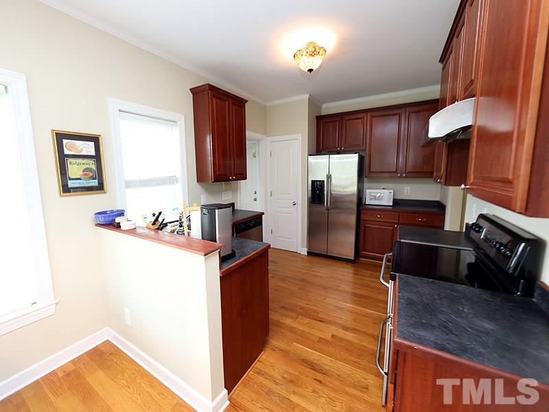 130 Russell Union Road Norlina, NC 27563 - Photo 8 of 20 a kitchen with stainless steel appliances granite countertop a refrigerator and a stove