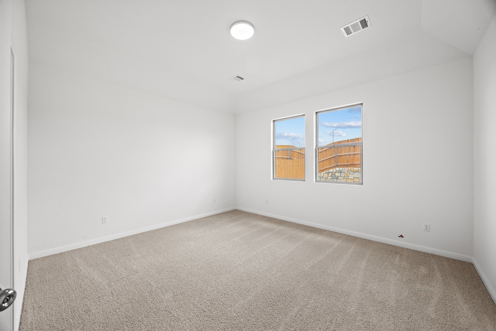 200 Hornet Street Elgin, TX 78621 - Photo 14 of 39 an empty room with windows