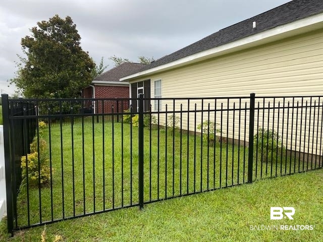 22713 Respite Lane Foley, AL 36535 - Photo 30 of 35 View of gate featuring a lawn