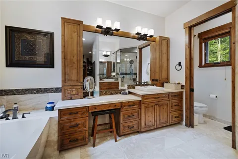 a front view of a house with a yard glass top table and chairs