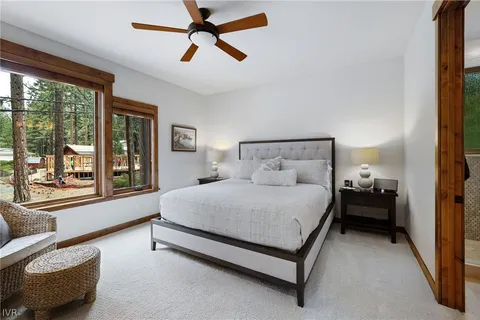 a view of a patio with table and chairs potted plants