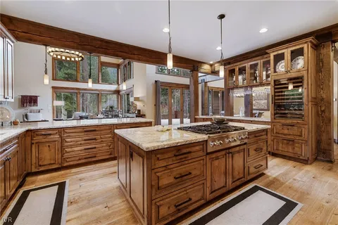 a living room with furniture a window and a ceiling fan