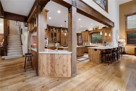 a view of backyard with seating space and trees