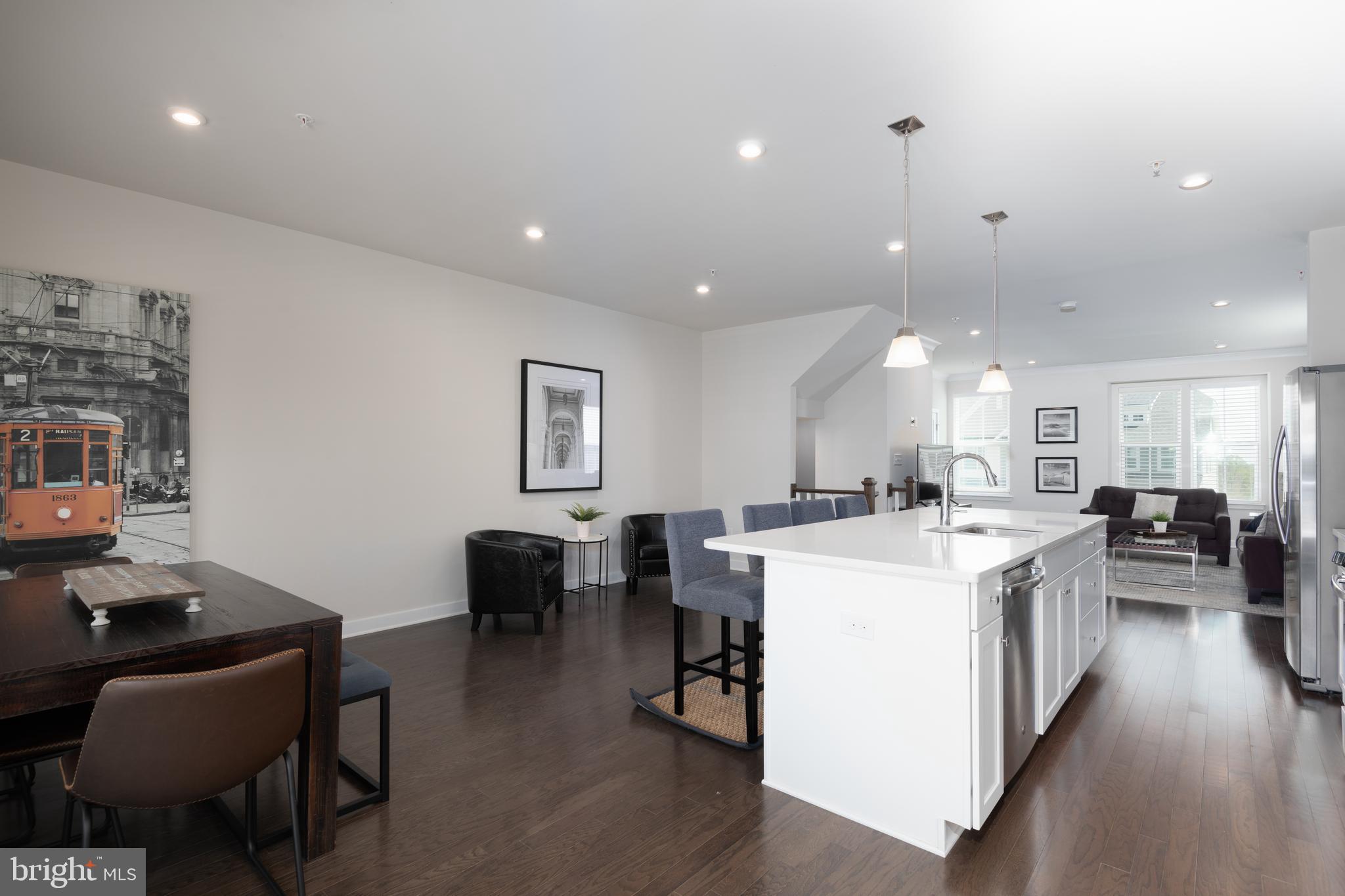 627 Quarry Point Road Malvern, PA 19355 - Photo 11 of 24 a living room with stainless steel appliances furniture a dining table and chairs