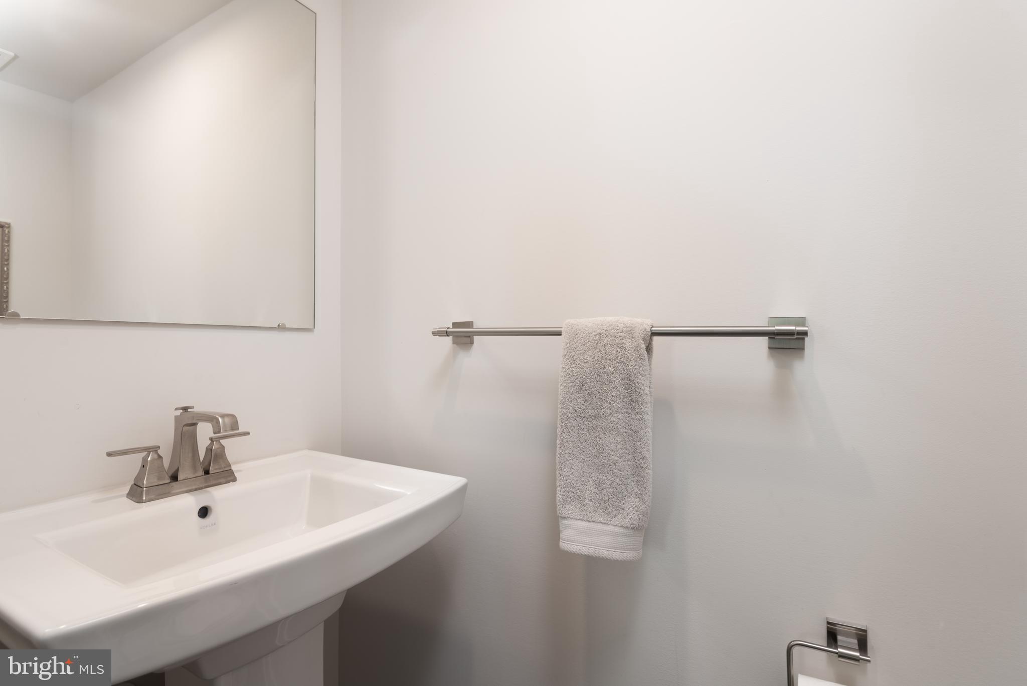 627 Quarry Point Road Malvern, PA 19355 - Photo 14 of 24 a bathroom with a sink and mirror