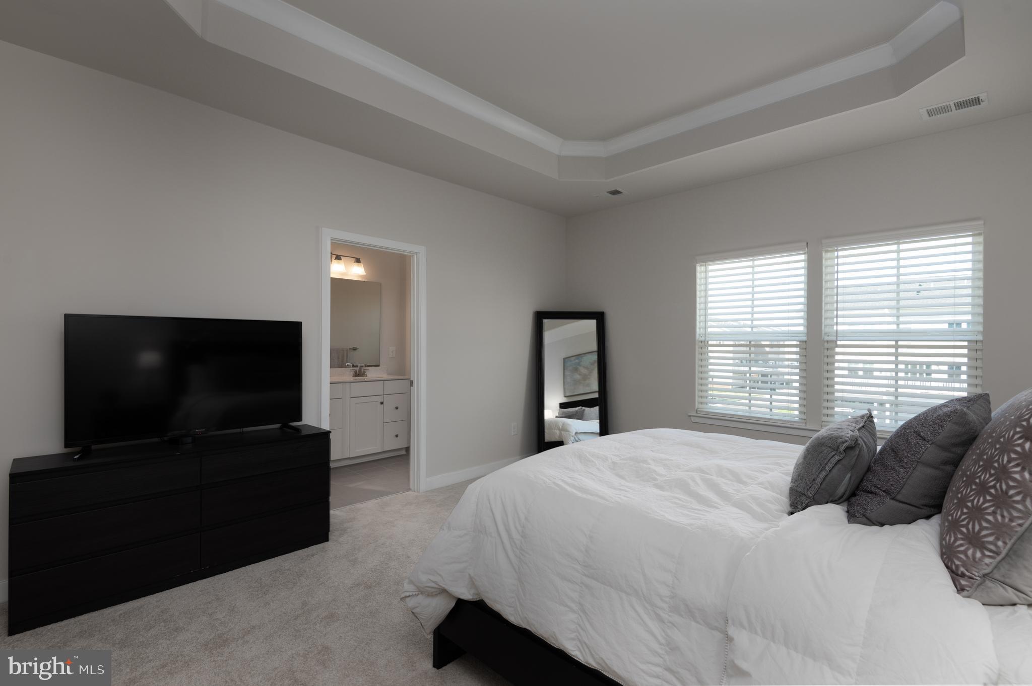 627 Quarry Point Road Malvern, PA 19355 - Photo 16 of 24 a bedroom with a flat screen tv and a bed