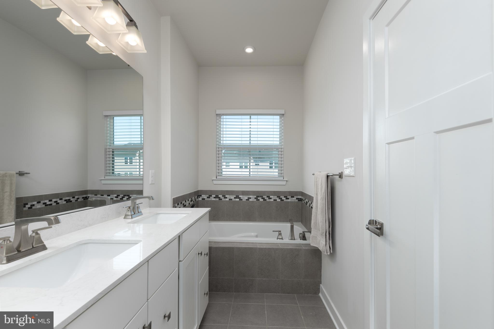 627 Quarry Point Road Malvern, PA 19355 - Photo 18 of 24 a bathroom with a bathtub and a sink
