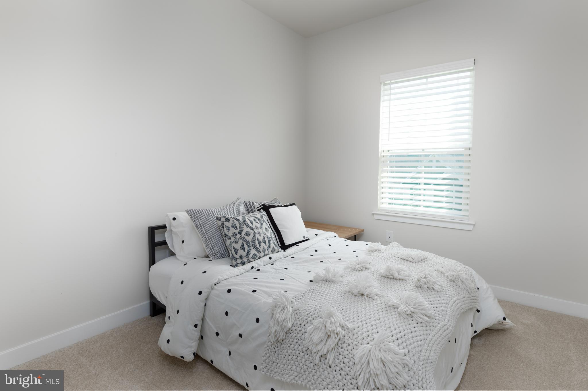 627 Quarry Point Road Malvern, PA 19355 - Photo 21 of 24 a large bed sitting in a bedroom next to a window