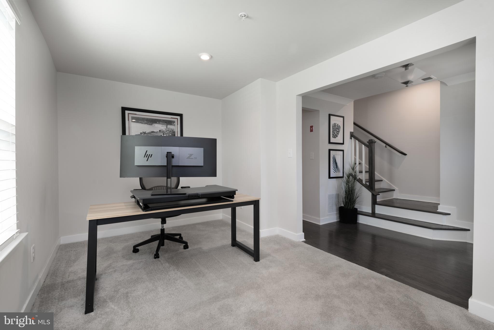 627 Quarry Point Road Malvern, PA 19355 - Photo 4 of 24 a view of a livingroom with a piano and a potted plant