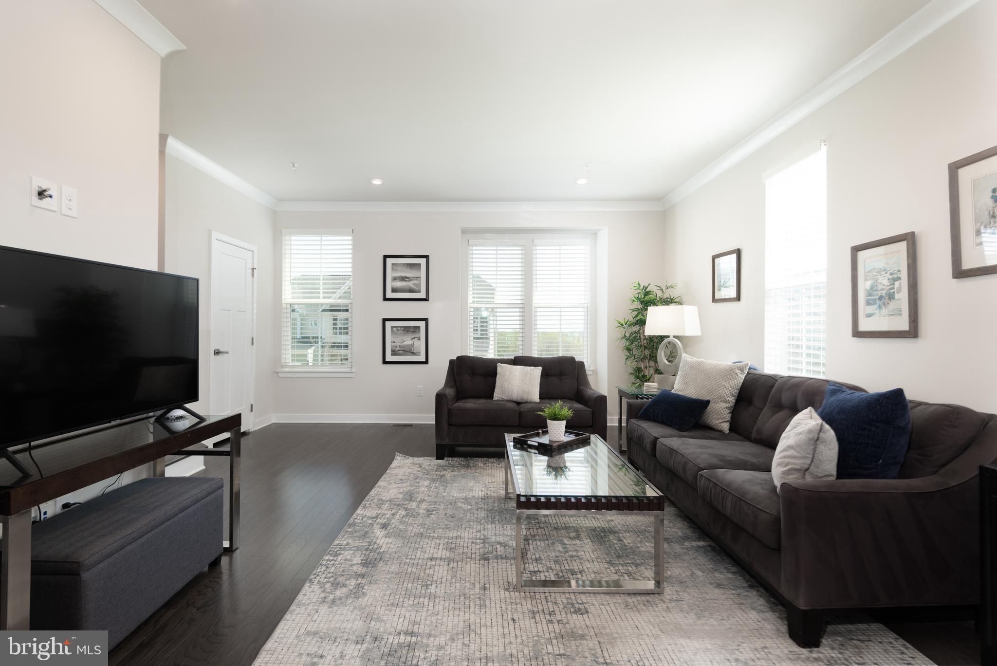 627 Quarry Point Road Malvern, PA 19355 - Photo 5 of 24 a living room with furniture and a flat screen tv