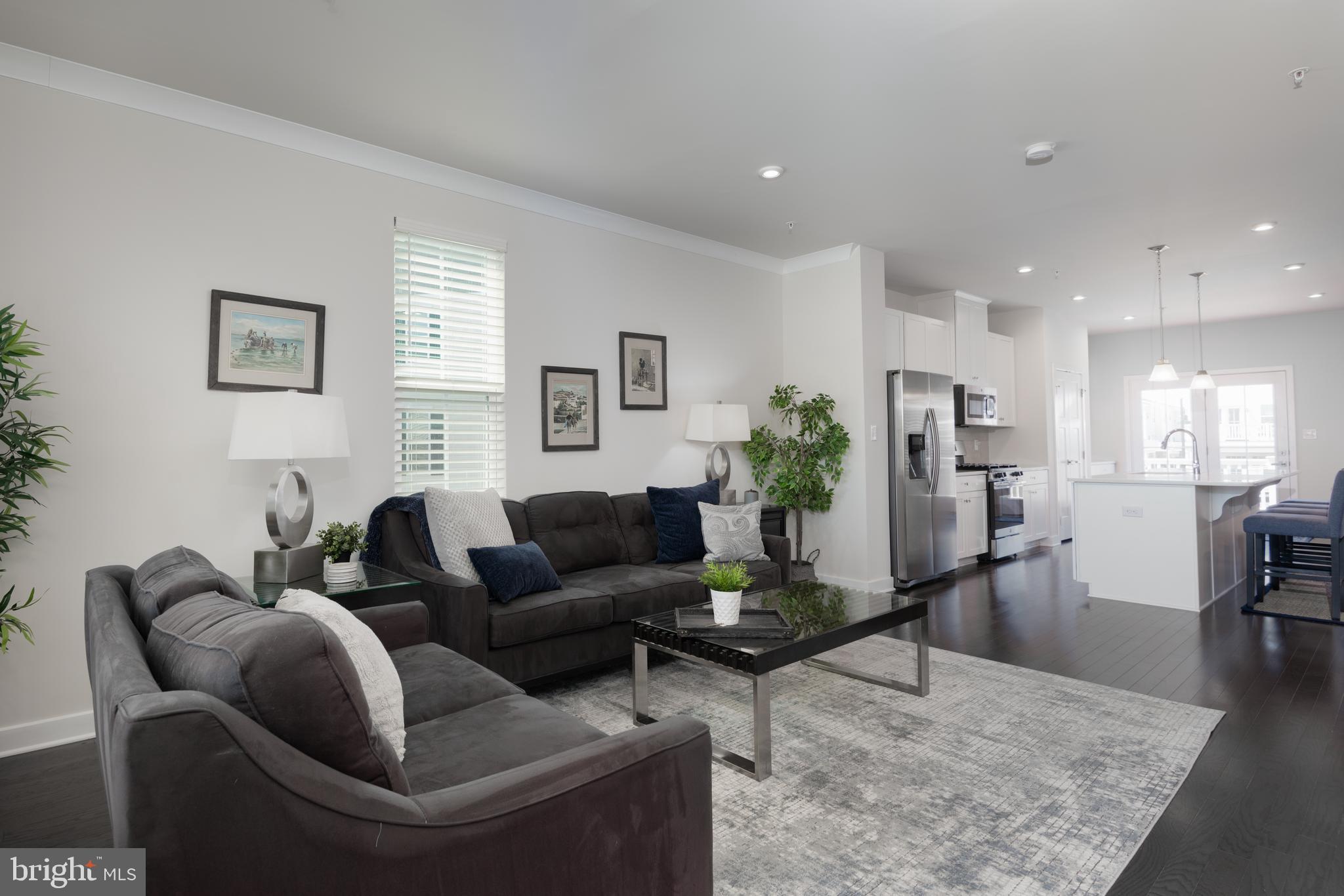 627 Quarry Point Road Malvern, PA 19355 - Photo 6 of 24 a living room with furniture potted plant and a table