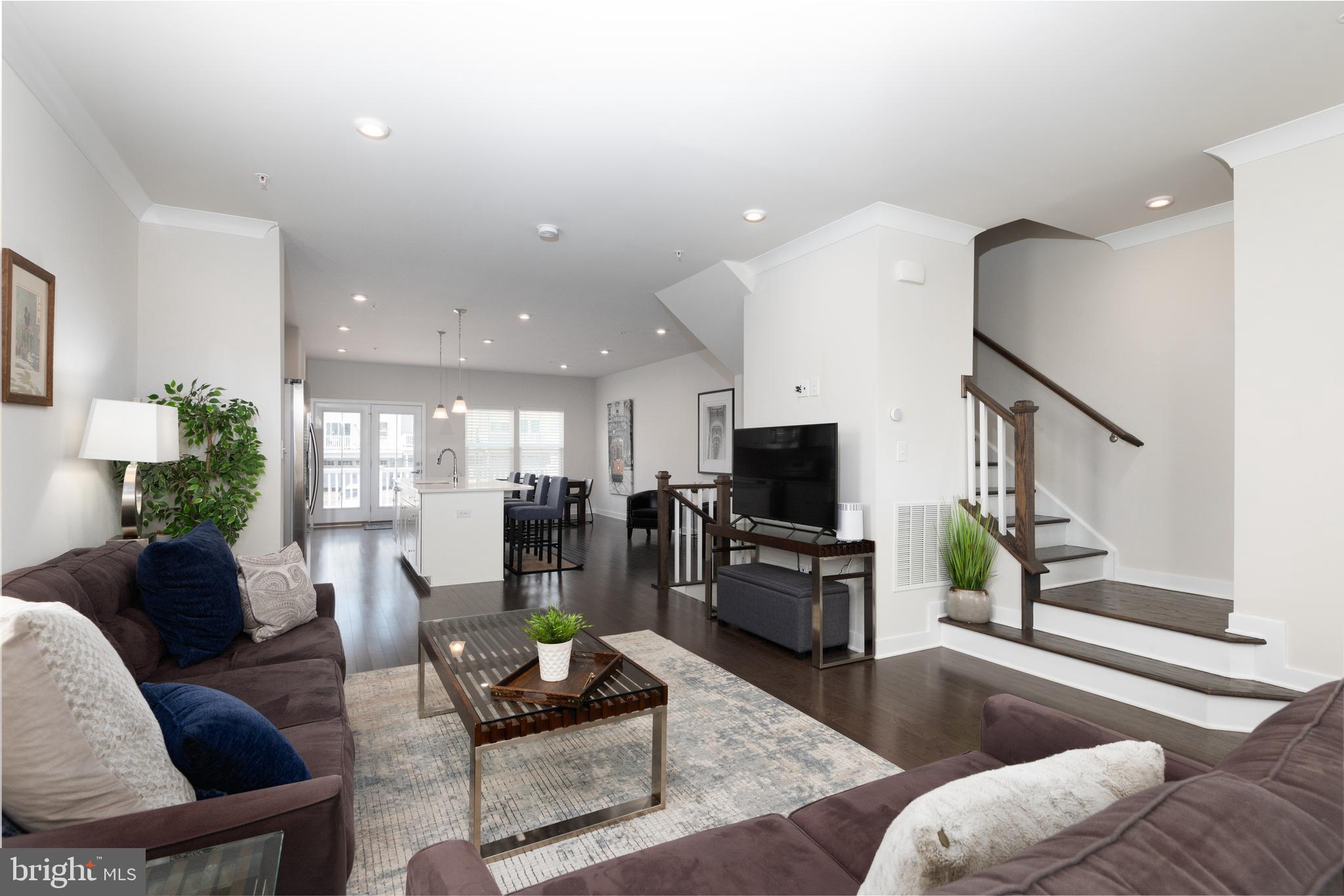 627 Quarry Point Road Malvern, PA 19355 - Photo 7 of 24 a living room with furniture and a flat screen tv