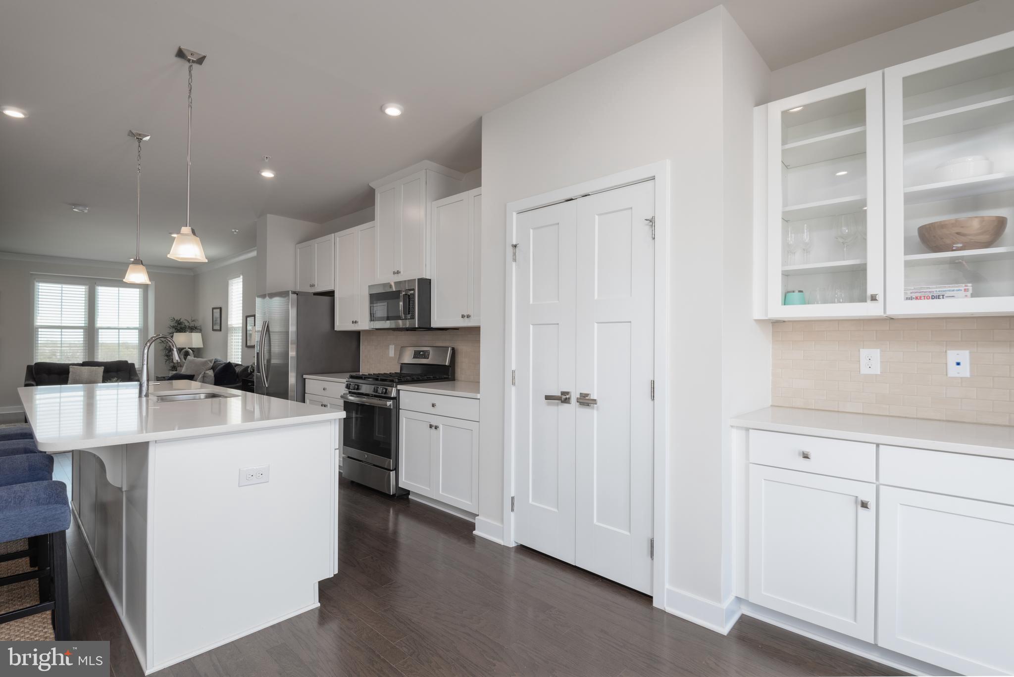 627 Quarry Point Road Malvern, PA 19355 - Photo 10 of 24 a large white kitchen with stainless steel appliances