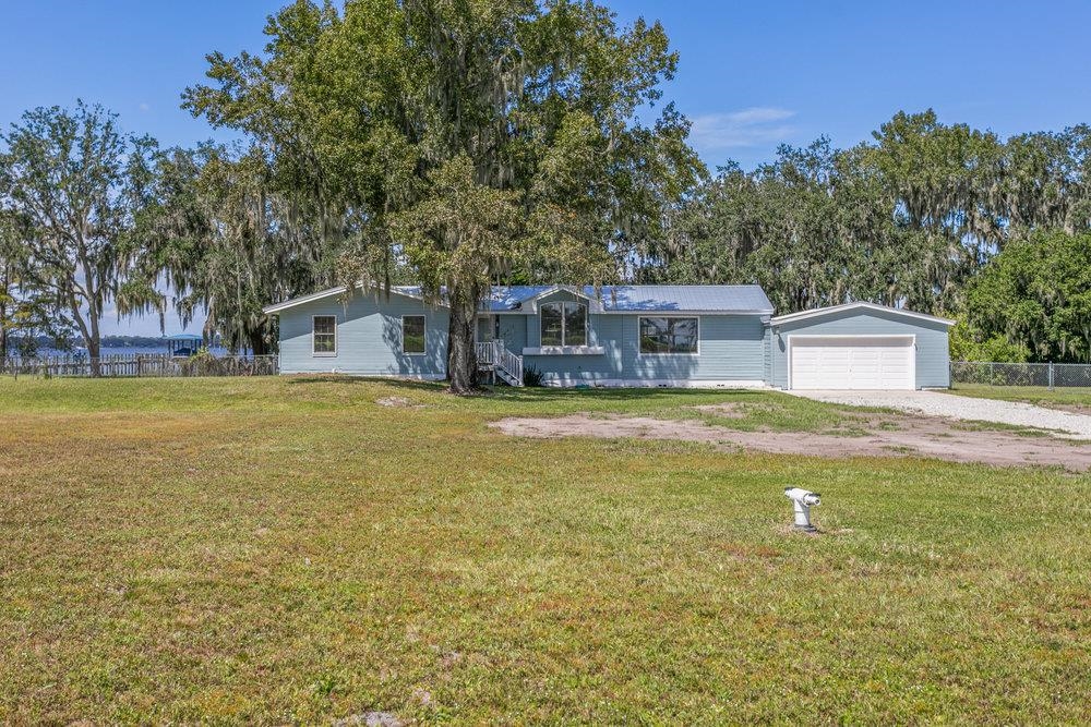 137 Mays Cove Road East Palatka, FL 32131 - Photo 1 of 70 a view of house with outdoor space and swimming pool