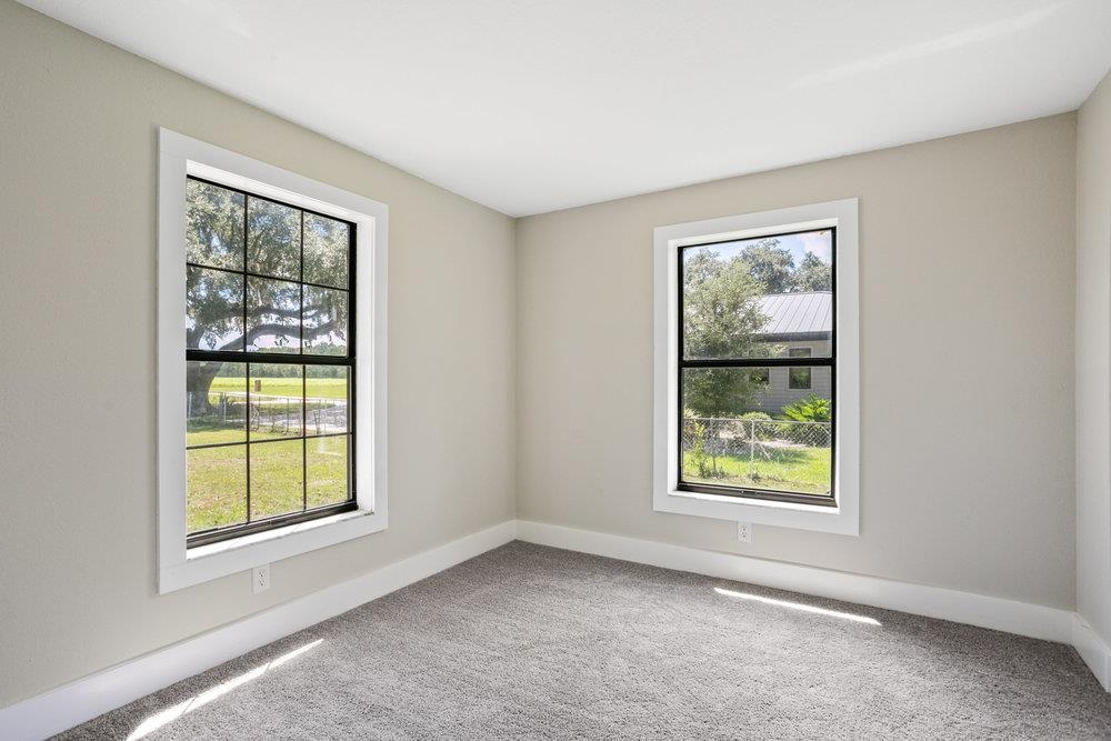 137 Mays Cove Road East Palatka, FL 32131 - Photo 23 of 70 an empty room with windows