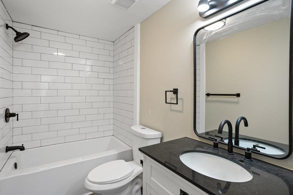 137 Mays Cove Road East Palatka, FL 32131 - Photo 26 of 70 a bathroom with a sink a toilet and shower