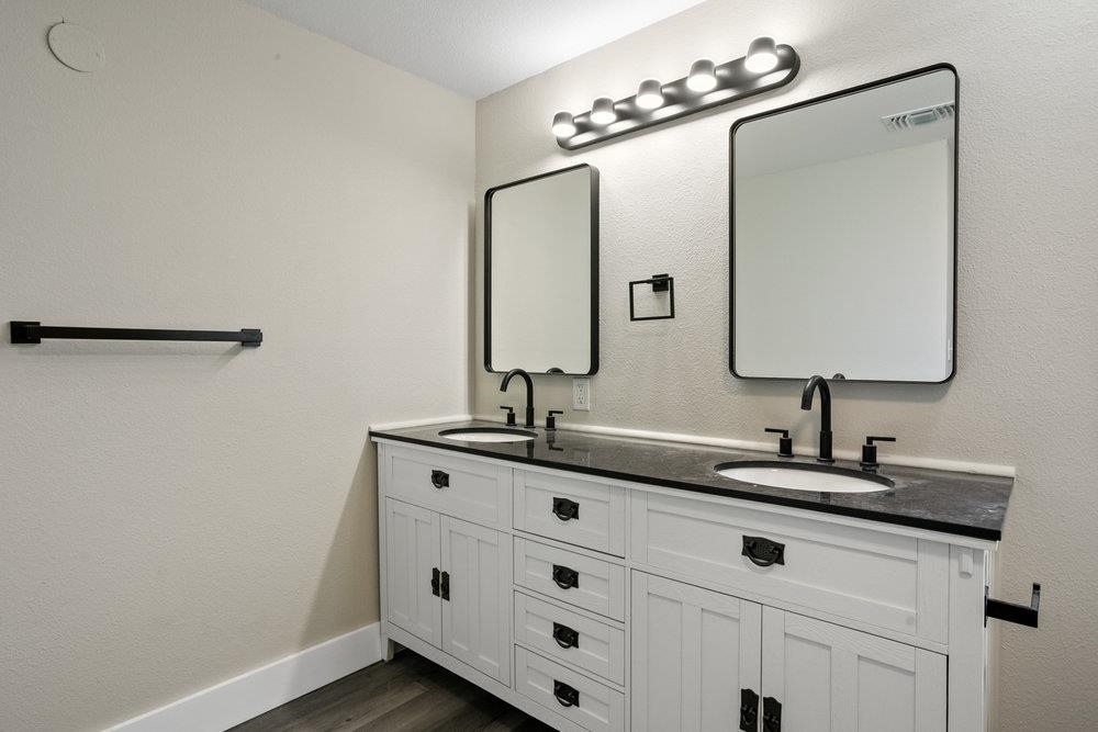 137 Mays Cove Road East Palatka, FL 32131 - Photo 29 of 70 a bathroom with a double vanity sink and a mirror