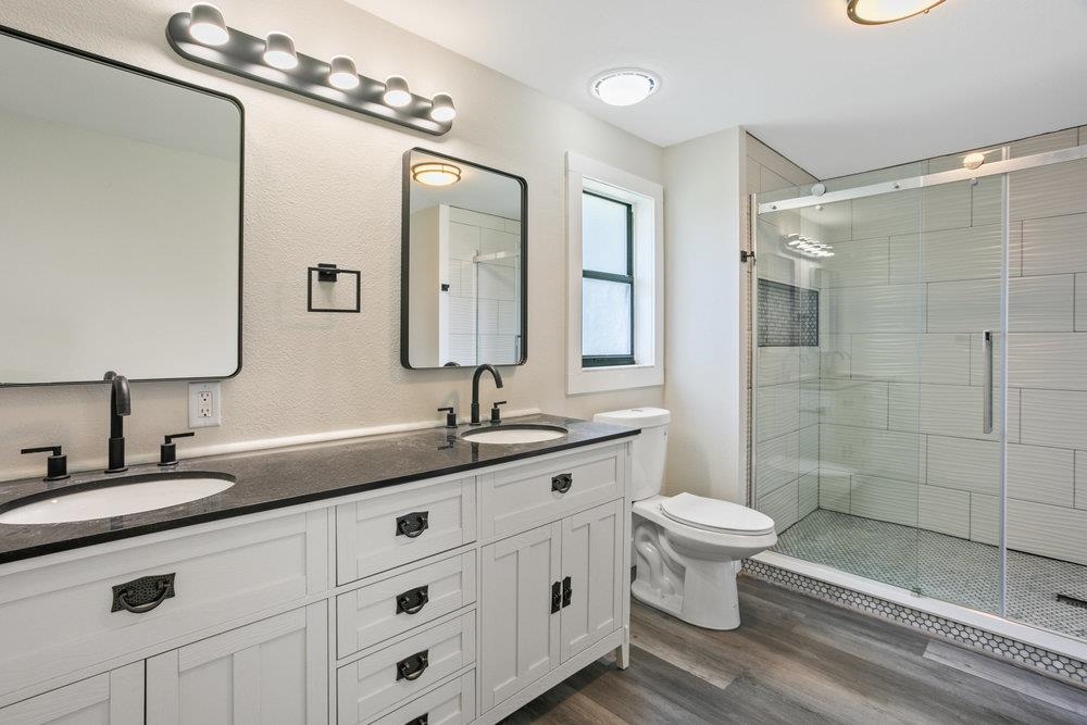 137 Mays Cove Road East Palatka, FL 32131 - Photo 30 of 70 a bathroom with a double vanity sink mirror and toilet