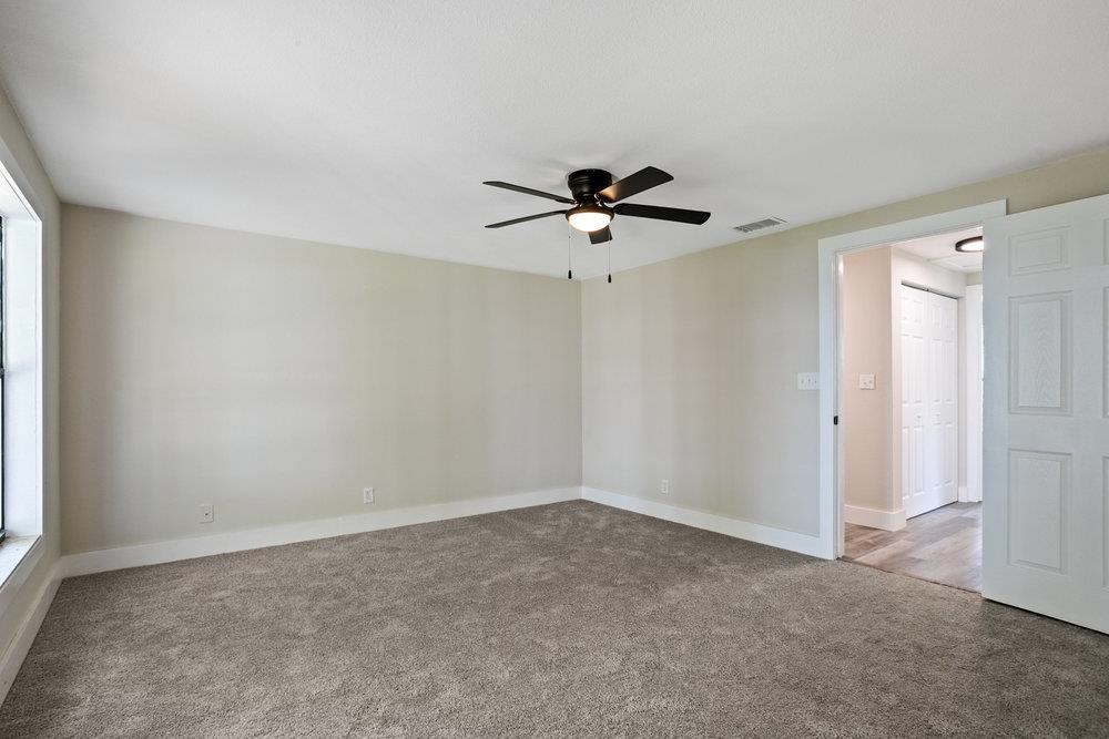 137 Mays Cove Road East Palatka, FL 32131 - Photo 35 of 70 a view of a livingroom with a ceiling fan and window
