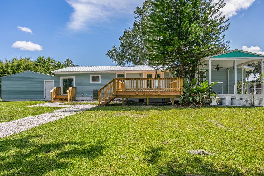 137 Mays Cove Road East Palatka, FL 32131 - Photo 38 of 70 a view of a house with a yard balcony and a patio