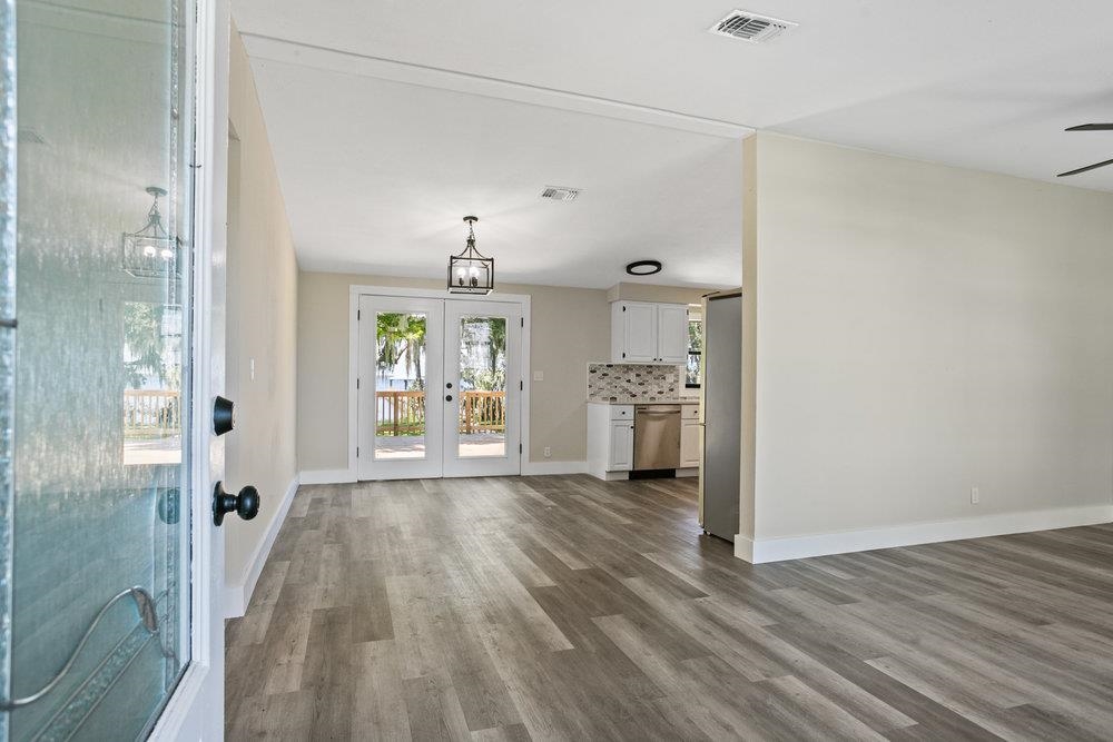 137 Mays Cove Road East Palatka, FL 32131 - Photo 5 of 70 a view of a kitchen with wooden floor and a window