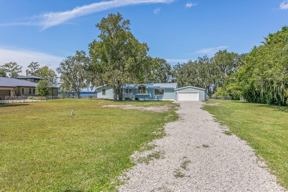 137 Mays Cove Road East Palatka, FL 32131 - Photo 67 of 70 a view of a swimming pool with a yard