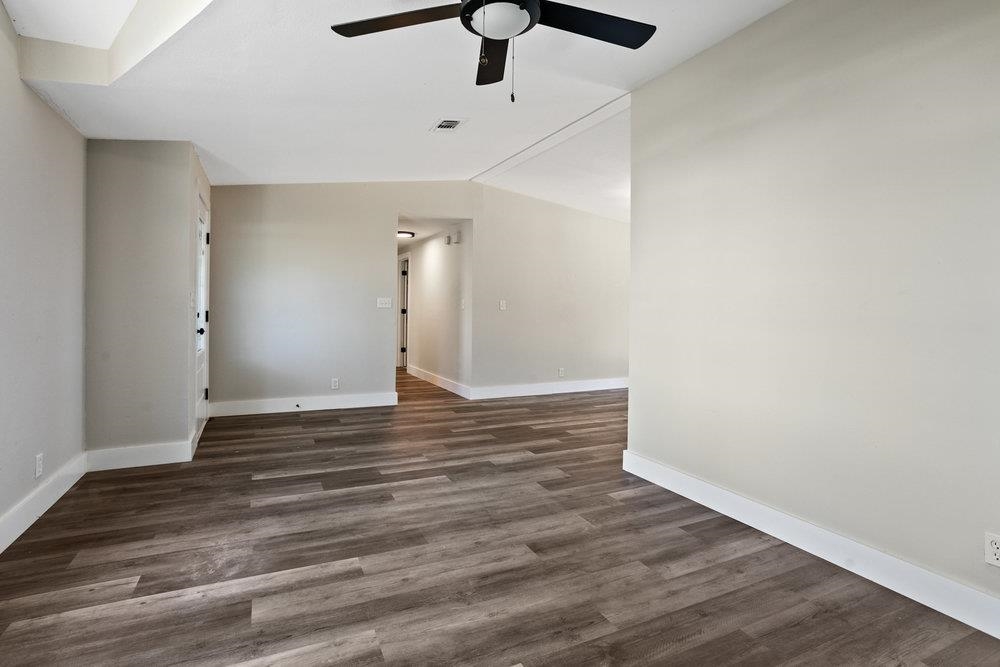 137 Mays Cove Road East Palatka, FL 32131 - Photo 7 of 70 a view of wooden floor and a chandelier fan in a room
