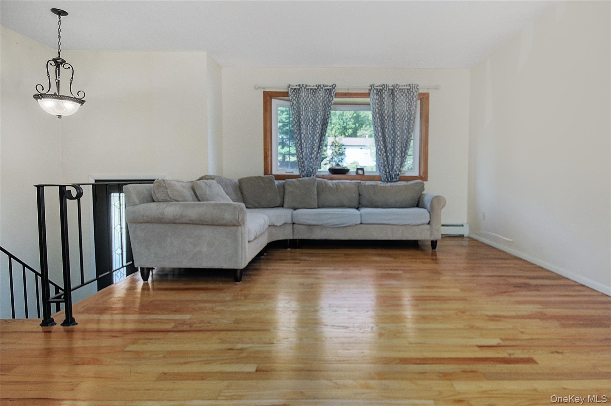 554 High Street Monroe, NY 10950 - Photo 9 of 29 a living room with furniture and a wooden floor