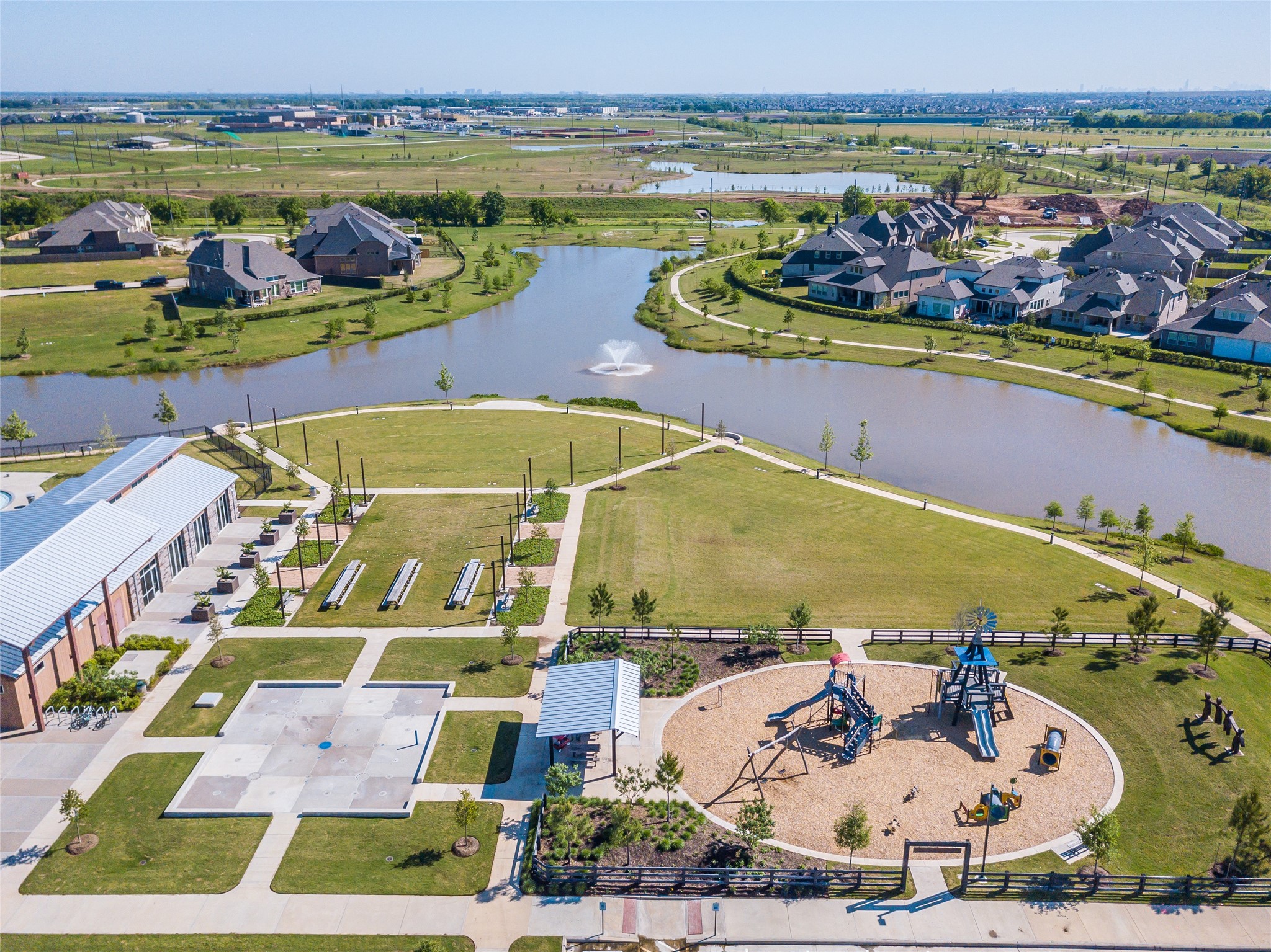3438 Rich Radish Road Richmond, TX 77406 - Photo 21 of 25 Expansive green spaces, scenic lakes, and thoughtfully designed recreation areas create an active outdoor lifestyle in Harvest Green. Residents enjoy playgrounds, gathering spaces, splash areas, and miles of connected trails woven throughout the community’s lake-lined landscape.