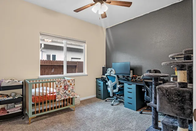 a bedroom with bed and a chandelier