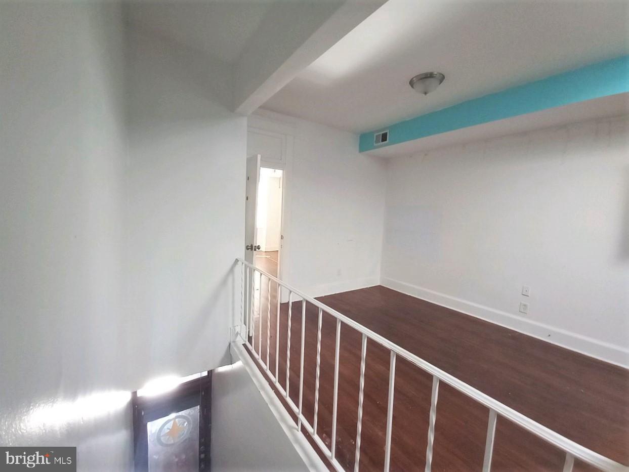 3216 Belair Road, Unit 2 Baltimore, MD 21213 - Photo 25 of 36 Interior Middle Space and Entrance Stairs