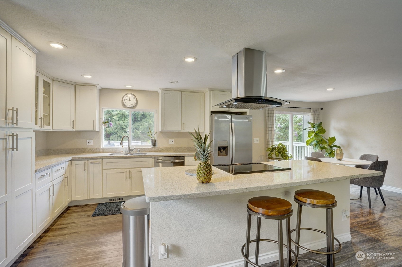 968 Brookdale Road East Tacoma, WA 98445 - Photo 11 of 31 a kitchen with sink and chairs