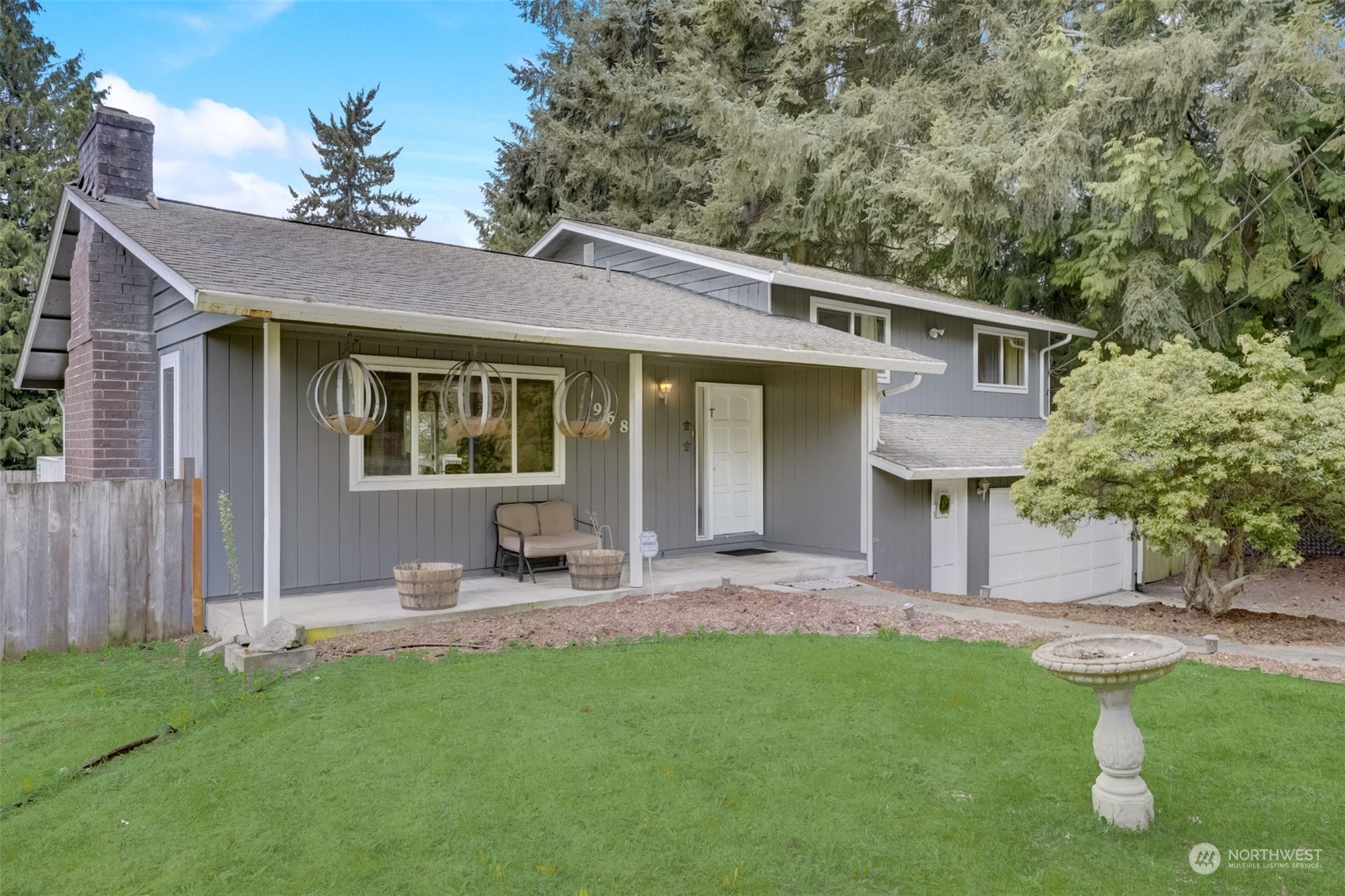 968 Brookdale Road East Tacoma, WA 98445 - Photo 2 of 31 a front view of a house with a garden and porch