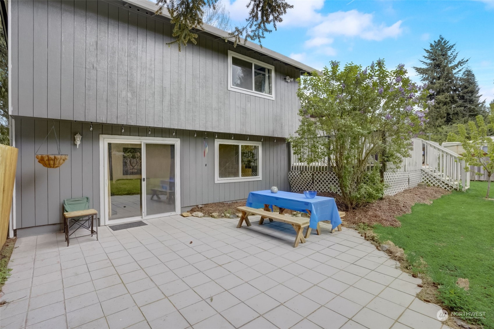 968 Brookdale Road East Tacoma, WA 98445 - Photo 26 of 31 a view of a house with backyard sitting area and garden